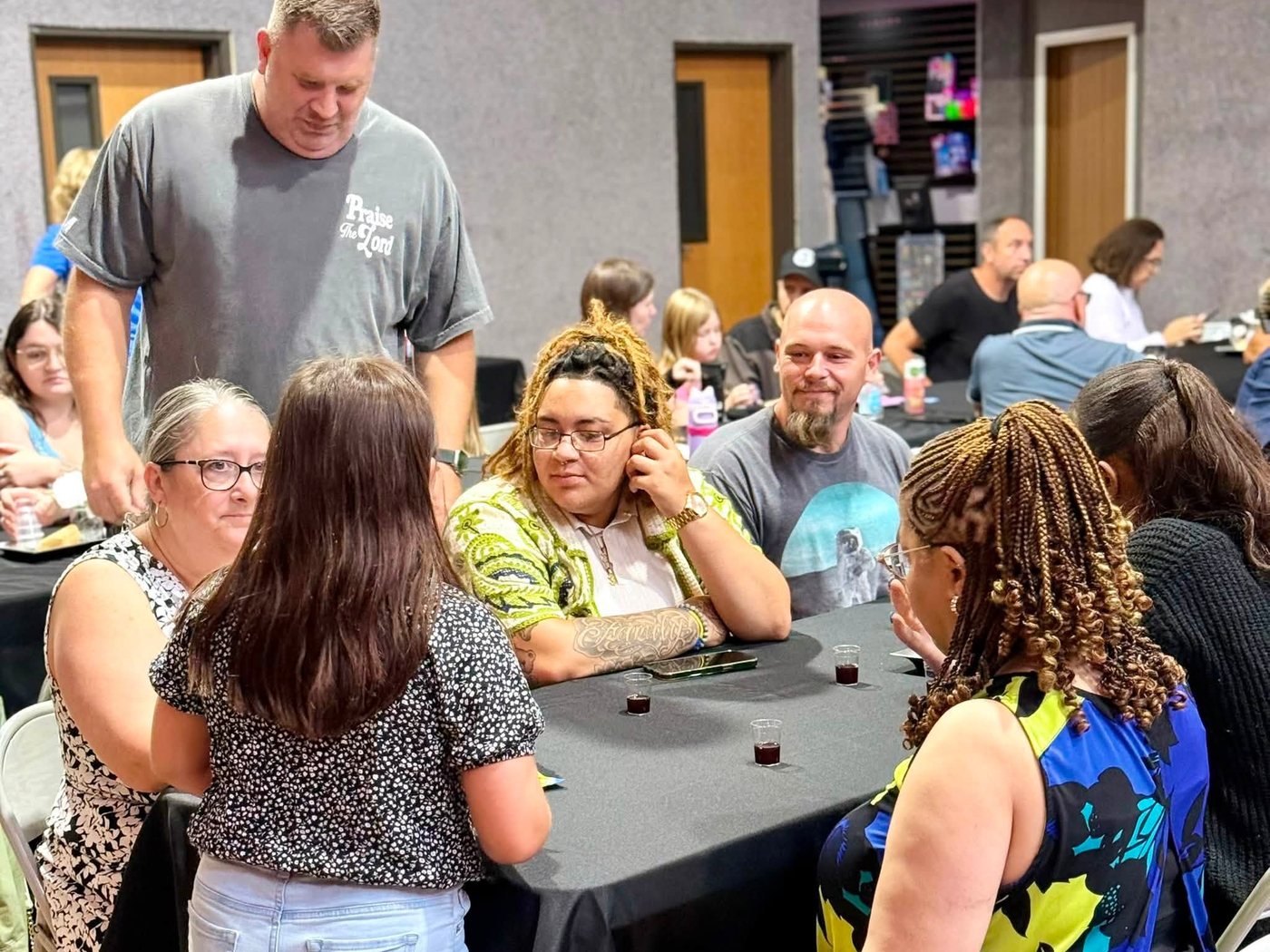 People around a table at a game night at HRCC